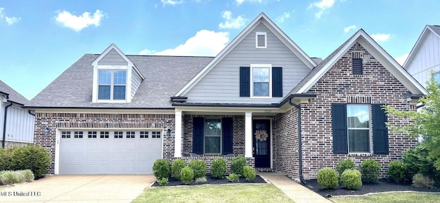 7228 Edgewater Dr, Olive Branch, MS 38654 - view of front facade with brick siding, concrete driveway, a garage, a shingled roof, and a porch