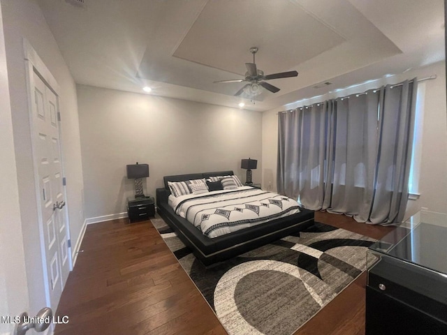 7228 Edgewater Dr, Olive Branch, MS 38654 - bedroom featuring a raised ceiling, hardwood / wood-style floors, baseboards, recessed lighting, and a ceiling fan