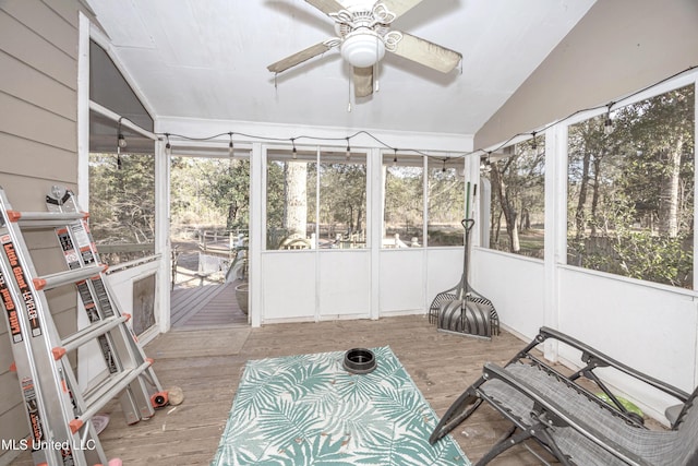 sunroom / solarium with vaulted ceiling and ceiling fan