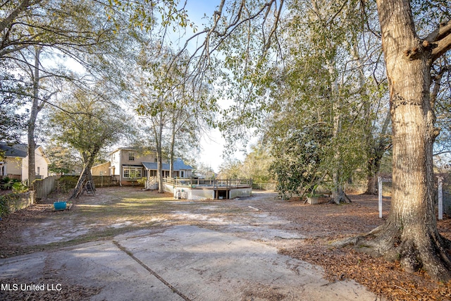 view of yard with a wooden deck