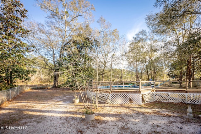 view of yard featuring a pool side deck