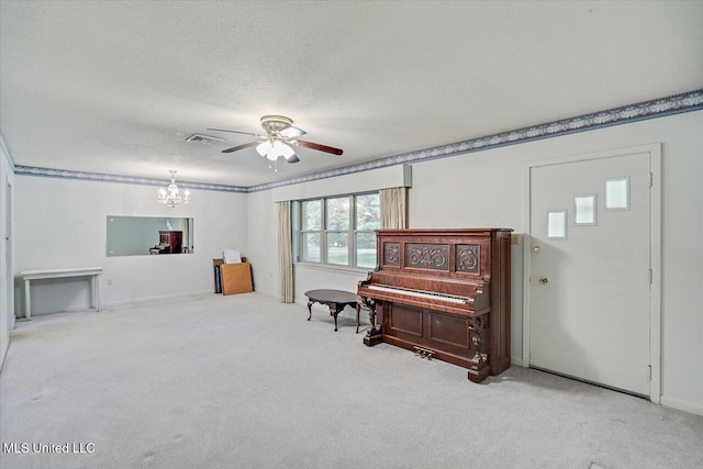 182 Brandon Williamsburg Rd, Mendenhall, MS 39114 - sitting room with ceiling fan, carpet, a chandelier, a textured ceiling, and ornamental molding