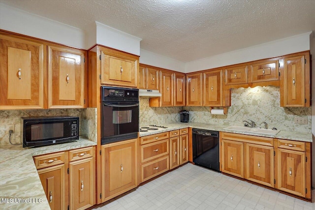 182 Brandon Williamsburg Rd, Mendenhall, MS 39114 - kitchen with black appliances, under cabinet range hood, brown cabinets, and a textured ceiling