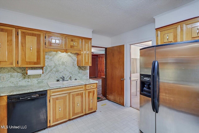 182 Brandon Williamsburg Rd, Mendenhall, MS 39114 - kitchen with dishwasher, stainless steel fridge, tasteful backsplash, brown cabinets, and a textured ceiling