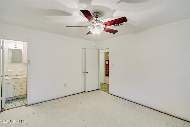 182 Brandon Williamsburg Rd, Mendenhall, MS 39114 - unfurnished bedroom featuring light floors, connected bathroom, and a ceiling fan