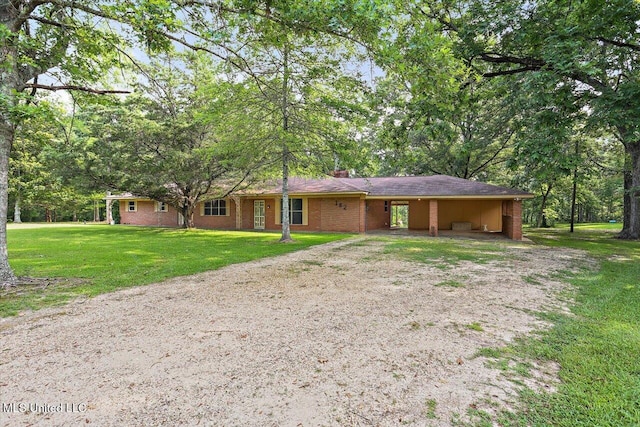 182 Brandon Williamsburg Rd, Mendenhall, MS 39114 - view of front of property featuring driveway, an attached carport, a chimney, and a front yard