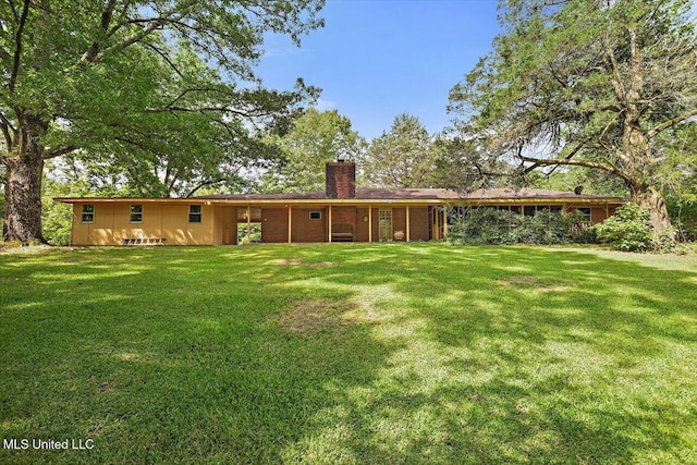 182 Brandon Williamsburg Rd, Mendenhall, MS 39114 - back of property with a chimney and a yard