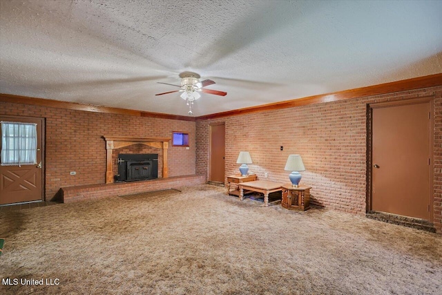 182 Brandon Williamsburg Rd, Mendenhall, MS 39114 - living area with brick wall, carpet, ceiling fan, and a textured ceiling
