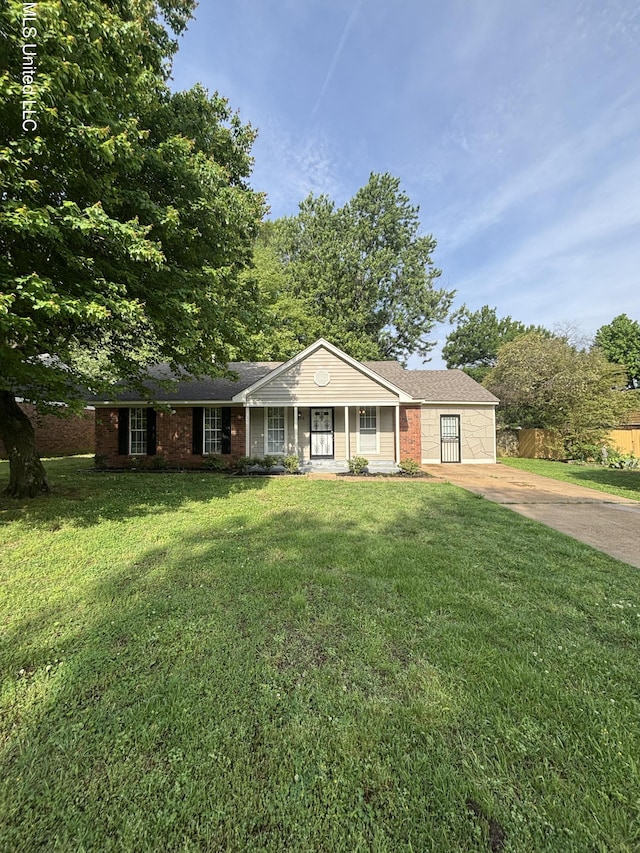 6405 Collinwood Rd, Horn Lake, MS 38637 - ranch-style house featuring fence, covered porch, a front yard, brick siding, and concrete driveway