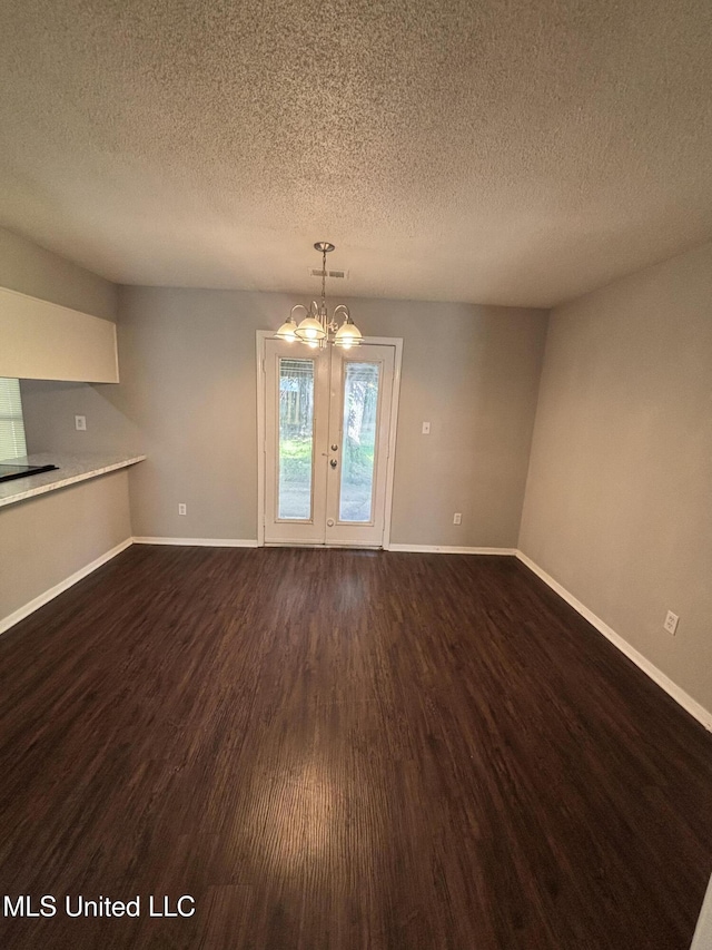 6405 Collinwood Rd, Horn Lake, MS 38637 - unfurnished dining area featuring a textured ceiling, a chandelier, french doors, baseboards, and dark wood-style floors