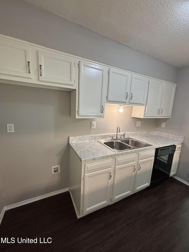 6405 Collinwood Rd, Horn Lake, MS 38637 - kitchen with a textured ceiling, dishwasher, a sink, baseboards, and dark wood-type flooring