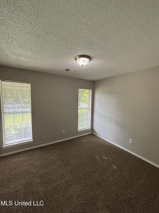 6405 Collinwood Rd, Horn Lake, MS 38637 - unfurnished room with carpet floors, baseboards, a textured ceiling, and visible vents