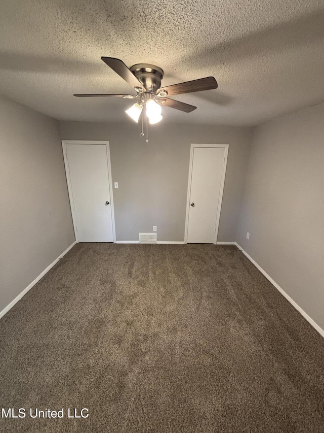 6405 Collinwood Rd, Horn Lake, MS 38637 - carpeted spare room featuring visible vents, a textured ceiling, baseboards, and ceiling fan
