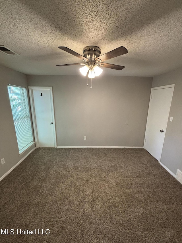 6405 Collinwood Rd, Horn Lake, MS 38637 - carpeted spare room featuring baseboards, a ceiling fan, a textured ceiling, and visible vents