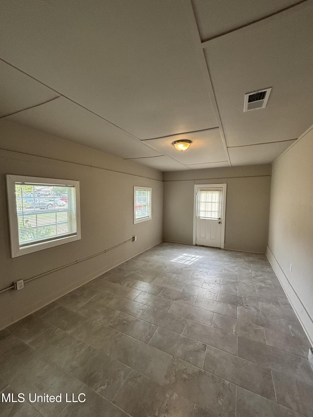 6405 Collinwood Rd, Horn Lake, MS 38637 - spare room featuring visible vents, stone finish flooring, and baseboards