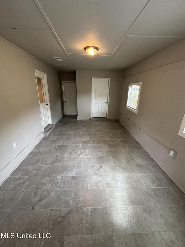 6405 Collinwood Rd, Horn Lake, MS 38637 - unfurnished bedroom featuring baseboards and stone finish floor