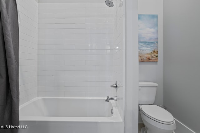 bathroom featuring toilet and shower / bath combo with shower curtain