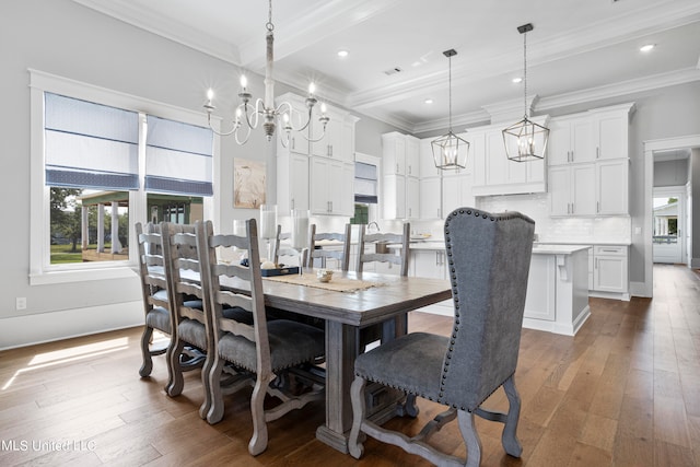 dining area featuring ornamental molding and dark hardwood / wood-style flooring