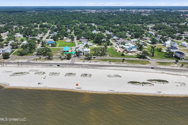 birds eye view of property featuring a water view and a view of the beach