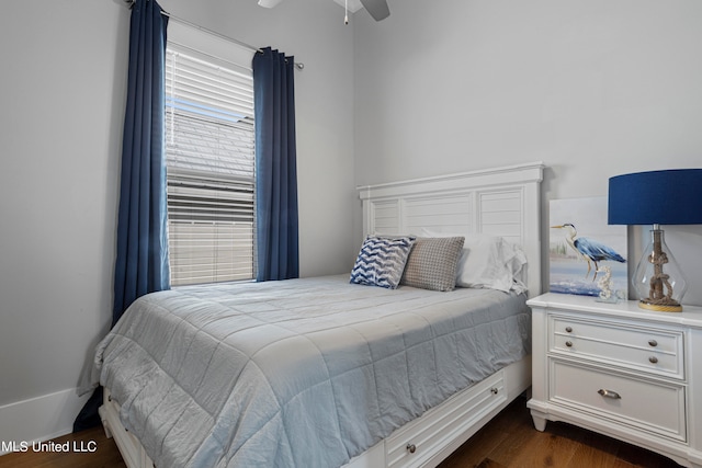 bedroom featuring dark hardwood / wood-style floors and ceiling fan