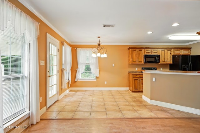 129 E Sunnybrook Rd, Carriere, MS 39426 - kitchen with black appliances, a chandelier, ornamental molding, pendant lighting, and brown cabinetry