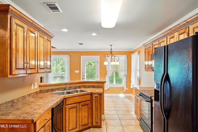 129 E Sunnybrook Rd, Carriere, MS 39426 - kitchen with black appliances, a sink, a peninsula, brown cabinetry, and baseboards