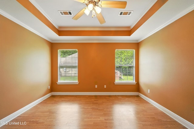 129 E Sunnybrook Rd, Carriere, MS 39426 - empty room with plenty of natural light, wood finished floors, a raised ceiling, ceiling fan, and ornamental molding