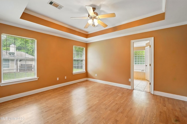 129 E Sunnybrook Rd, Carriere, MS 39426 - unfurnished room with a raised ceiling, light wood-style floors, ornamental molding, a ceiling fan, and baseboards