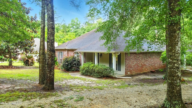 129 E Sunnybrook Rd, Carriere, MS 39426 - view of front facade featuring brick siding and roof with shingles