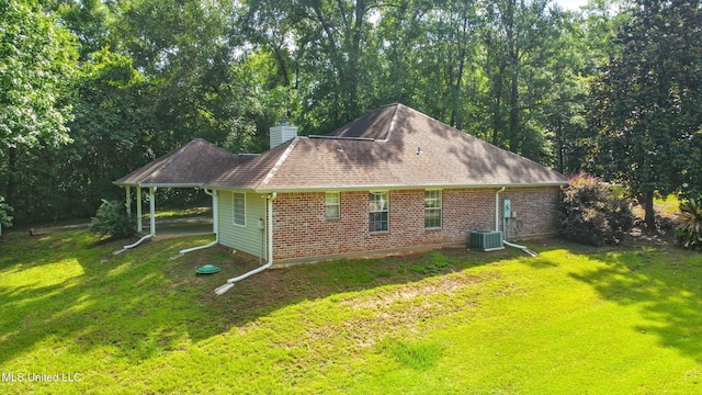 129 E Sunnybrook Rd, Carriere, MS 39426 - view of side of property featuring a chimney, a yard, and brick siding