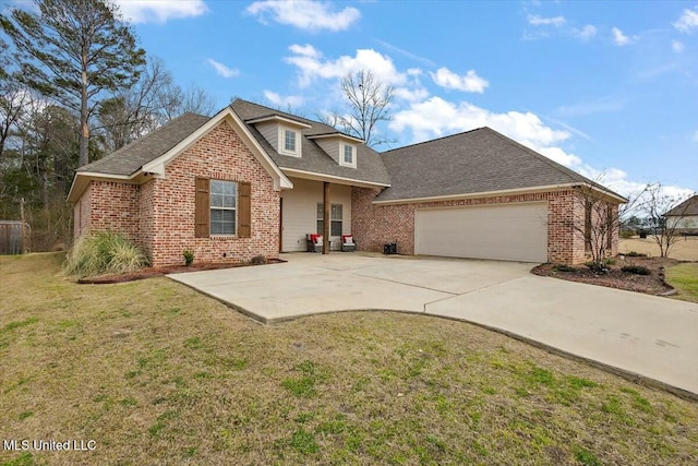 view of front facade with driveway, a shingled roof, an attached garage, a front lawn, and brick siding