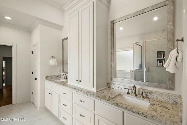 bathroom featuring crown molding, marble finish floor, a sink, and a marble finish shower