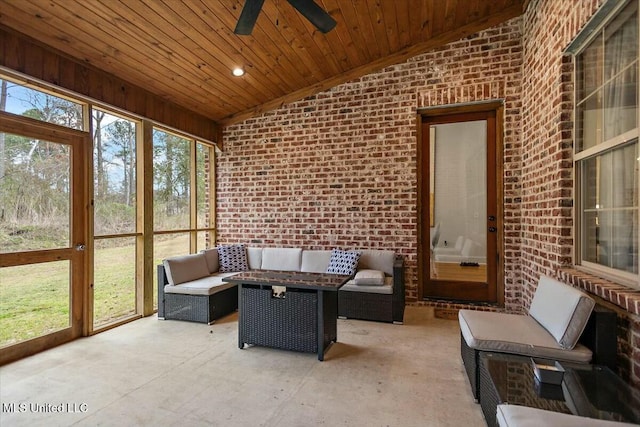 sunroom / solarium with lofted ceiling, wood ceiling, and a ceiling fan