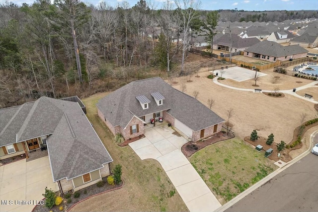 birds eye view of property with a residential view