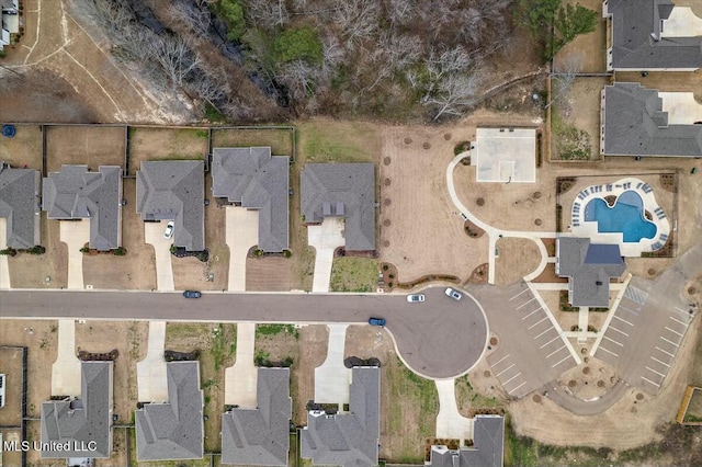 birds eye view of property with a residential view