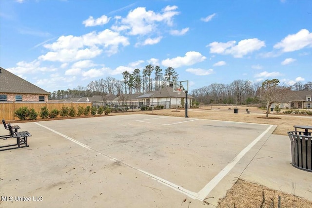 exterior space with community basketball court and fence