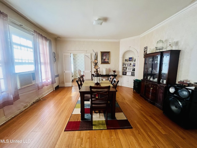 58 Snider St, Grenada, MS 38901 - dining area featuring wood finished floors, crown molding, and built in shelves