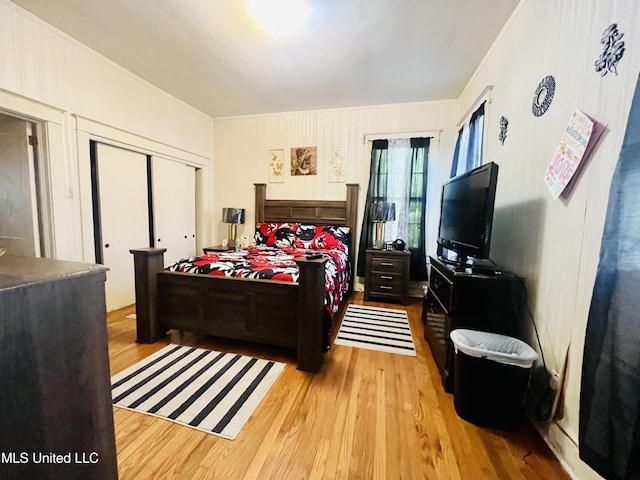 58 Snider St, Grenada, MS 38901 - bedroom with wood finished floors, a closet, and crown molding