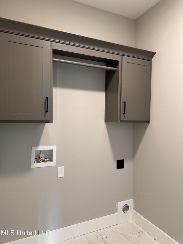 1740 Bakersfield Way, Nesbit, MS 38651 - laundry area featuring electric dryer hookup, washer hookup, baseboards, marble finish flooring, and cabinet space