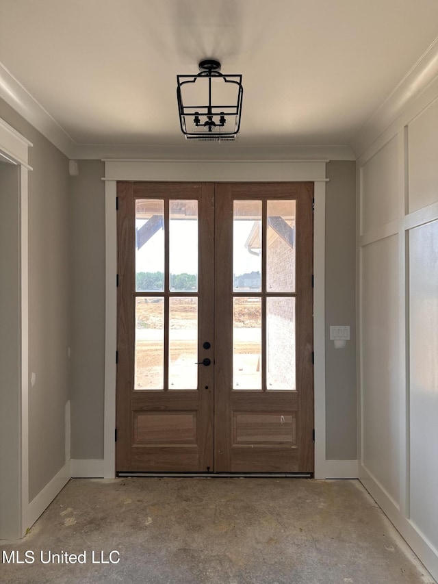 1740 Bakersfield Way, Nesbit, MS 38651 - doorway with french doors, baseboards, concrete flooring, and crown molding