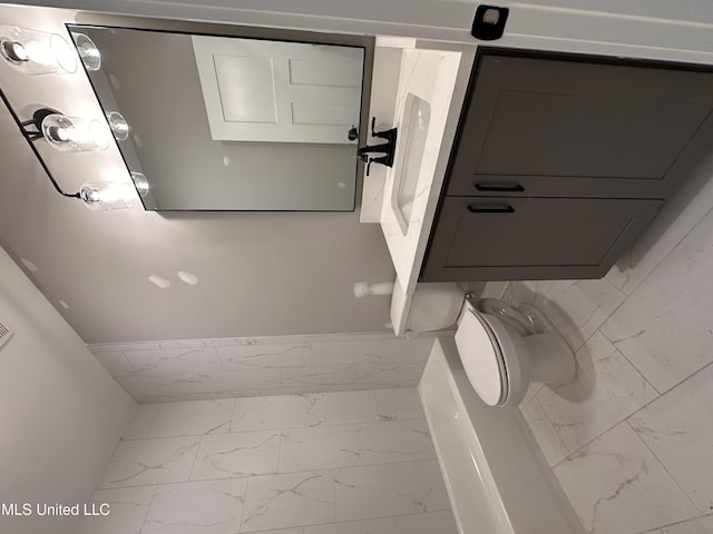 1740 Bakersfield Way, Nesbit, MS 38651 - bathroom featuring marble look tiles