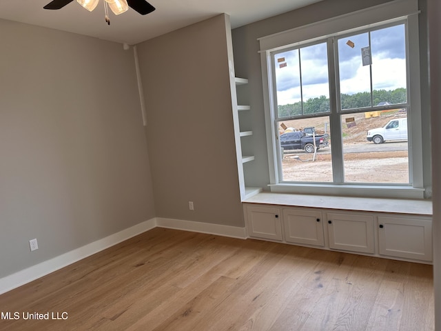 1740 Bakersfield Way, Nesbit, MS 38651 - spare room featuring light wood-style flooring, ceiling fan, and baseboards