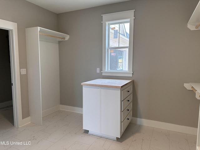 1740 Bakersfield Way, Nesbit, MS 38651 - walk in closet with light marble finish flooring