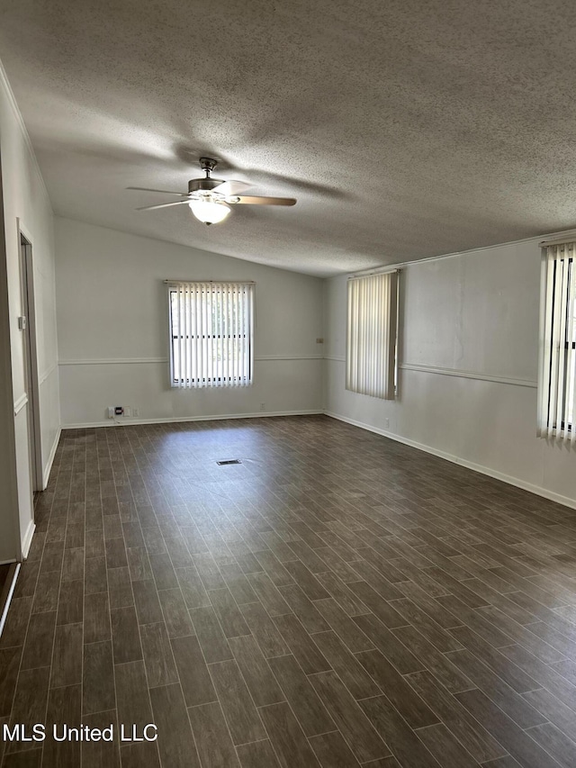 97131 Kapalama Dr, Diamondhead, MS 39525 - unfurnished room featuring ceiling fan, dark wood finished floors, baseboards, a textured ceiling, and lofted ceiling