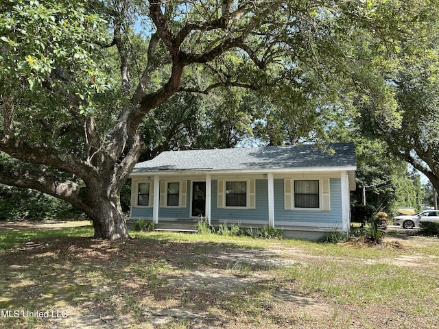 97131 Kapalama Dr, Diamondhead, MS 39525 - view of front facade with covered porch and roof with shingles