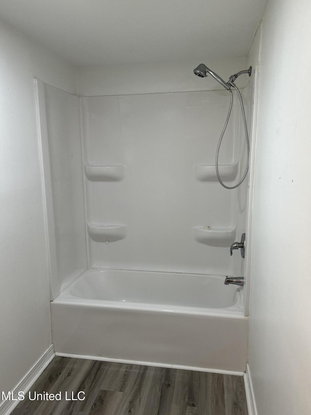 97131 Kapalama Dr, Diamondhead, MS 39525 - full bath with wood finished floors, bathing tub / shower combination, and baseboards