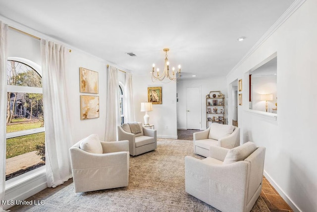 living room with a notable chandelier and ornamental molding