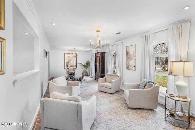 living room with ornamental molding and a notable chandelier