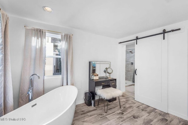 bathroom with hardwood / wood-style flooring and plus walk in shower