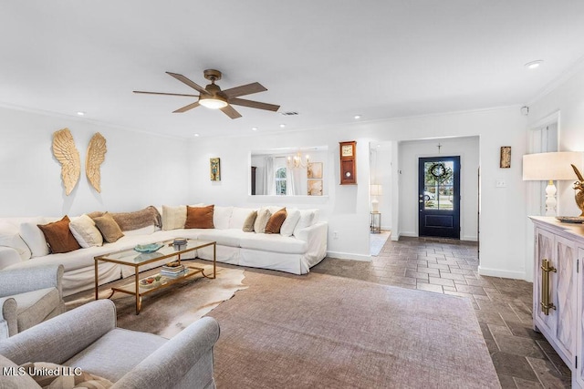 living room featuring ornamental molding and ceiling fan with notable chandelier